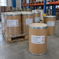 Shrink-wrapped brown fiber drums labeled 2-Iodo-4-nitroaniline CAS 6293-83-0 with 25 kg net weight and hazard symbols on a wooden pallet in a warehouse with racks behind.