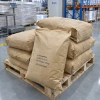 2-iodoaniline-cas-615-43-0-25kg-paper-bags-pallet Stacked 25kg brown paper bags of 2-Iodoaniline CAS 615-43-0 on a wooden pallet in a finished goods warehouse area with a platform scale behind.