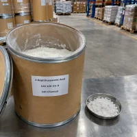 2-naphthoxyacetic-acid-cas-120-23-0-white-powder-fiber-drum Open cardboard fiber drum with inner plastic liner containing white 2-naphthoxyacetic acid (CAS 120-23-0) powder, next to a stainless steel dish of powder sample