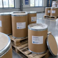 artemisinin-25kg-fiber-drums-open-drum Artemisinin (CAS 63968-64-9) in 25 kg fiber drums on pallets, one open drum showing white crystals inside