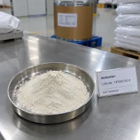 azilsartan-powder-stainless-dish-display Azilsartan (CAS 147403-03-0) white powder pile in a stainless steel dish with a UAT Chemical sign card beside it