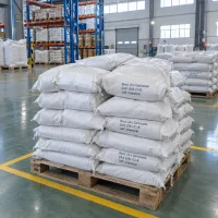 White woven polypropylene sacks of basic zinc carbonate (CAS 5263-02-5) printed with UAT Chemical, stacked on a pallet