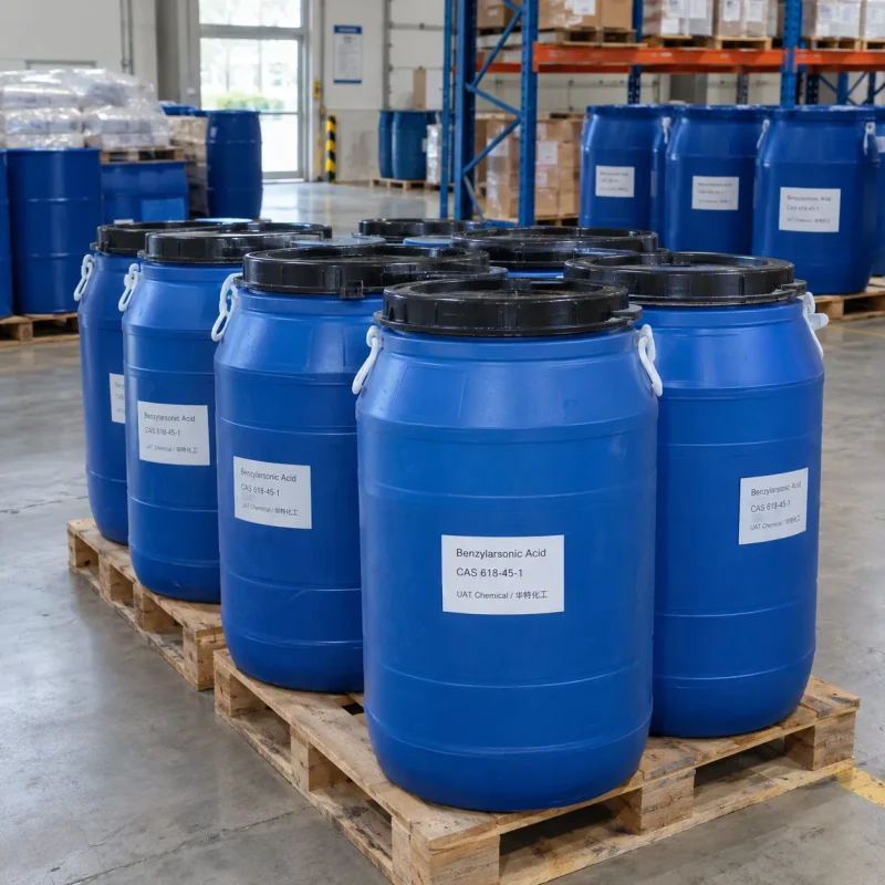 Blue open-head plastic drums of benzylarsonic acid (CAS 618-45-1) labeled UAT Chemical on wooden pallets in a warehouse