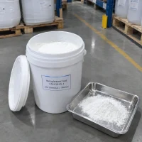 White powder of benzylarsonic acid (CAS 618-45-1) in an open plastic pail and stainless steel tray, UAT Chemical label