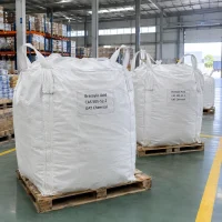 brassylic-acid-cas-505-52-2-fibc-bulk-bags White FIBC bulk bags of brassylic acid (CAS 505-52-2) labeled UAT Chemical standing in a row on pallets in a warehouse
