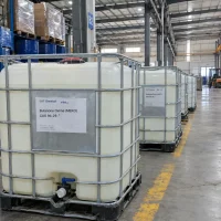 butanone-oxime-meko-cas-96-29-7-ibc-tanks-warehouse Row of IBC tanks labeled Butanone Oxime (MEKO) CAS 96-29-7 with 1000 kg net weight in a warehouse with racks and a forklift in the background.
