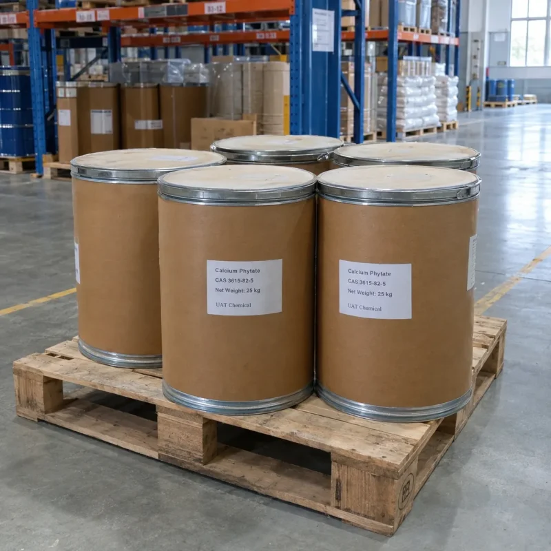 Five 25kg fiber drums of Calcium Phytate CAS 3615-82-5 on a wooden pallet in a warehouse storage area.