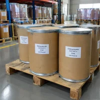 Cardboard fiber drums of chloroacetamide (CAS 79-07-2), 25 kg each, on a wooden pallet in a warehouse