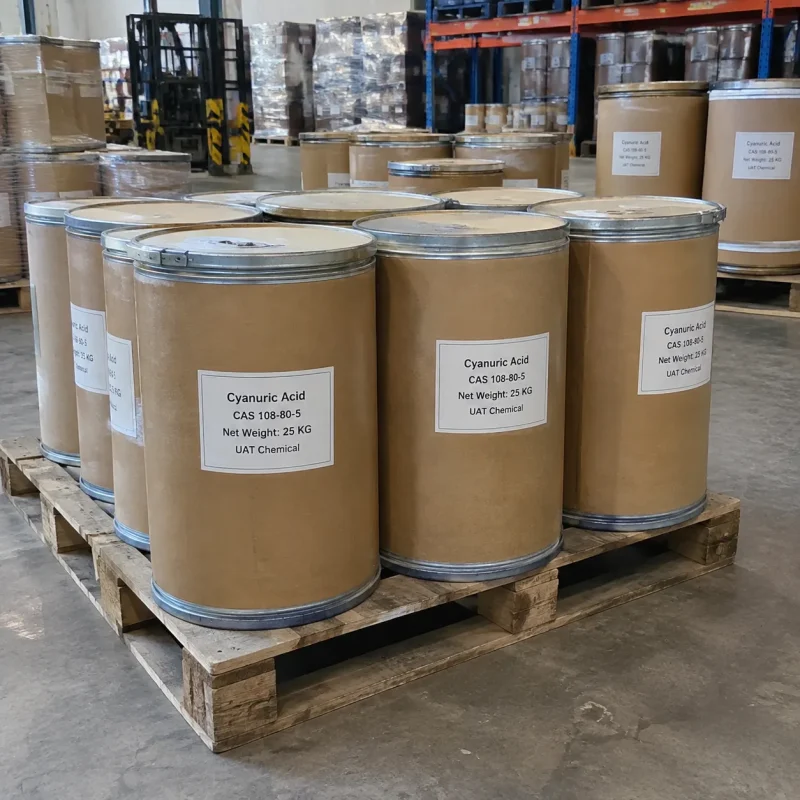 Several 25kg brown fiber drums of Cyanuric Acid CAS 108-80-5 on a wooden pallet in a warehouse with a forklift behind.