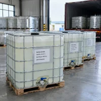 White IBC totes of diethyl sulfate (CAS 64-67-5), 1000 kg each, near a loading container