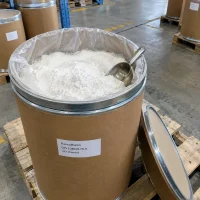 flazasulfuron-cas-104040-78-0-white-powder-fiber-drum Open cardboard fiber drum with plastic liner containing white flazasulfuron (CAS 104040-78-0) powder and a stainless steel scoop