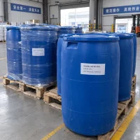 glacial-acetic-acid-cas-64-19-7-blue-plastic-drums-pallet Blue plastic drums labeled Glacial Acetic Acid CAS 64-19-7 on wooden pallets in a warehouse, some wrapped in stretch film, with a forklift in the background.