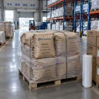 Pallet of 25kg paper bags of Glycine CAS 56-40-6 wrapped in plastic film in a warehouse.