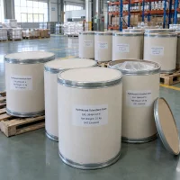 Several 25kg fiber drums of Hydrolyzed Sclerotium Gum CAS 39464-87-4 on pallets, with one drum open showing the inner plastic liner.