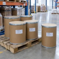 l-theanine-cas-3081-61-6-25kg-fiber-drums-pallet Several 25kg fiber drums of L-Theanine CAS 3081-61-6 on a wooden pallet in a warehouse storage area.