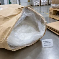 l-theanine-cas-3081-61-6-white-powder-open-bag-sample Open brown bag showing white L-Theanine powder CAS 3081-61-6 with a product label on a stainless steel table.