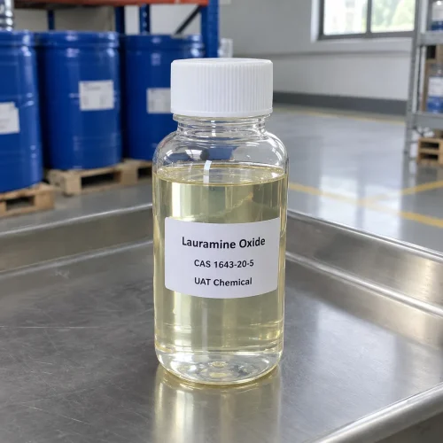 A clear plastic bottle containing pale yellow Lauramine Oxide liquid CAS 1643-20-5, with blue drums in the background.