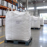 magnesium-chloride-cas-7786-30-3-fibc-ton-bags Magnesium chloride CAS 7786-30-3 in white FIBC ton bags standing on pallets in warehouse