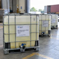 IBC totes of 1000 L monoethanolamine oleate (CAS 2272-11-9) filled with pale yellow liquid in a loading area