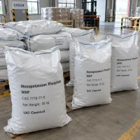 monopotassium-phosphate-cas-7778-77-0-50kg-woven-bags Monopotassium phosphate (MKP, CAS 7778-77-0) packed in 50 kg white woven bags labeled UAT Chemical on warehouse pallets