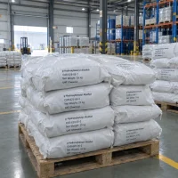 p-hydroxybenzyl-alcohol-cas-623-05-2-25kg-woven-bags-pallets White woven bags of p-Hydroxybenzyl Alcohol (CAS 623-05-2), 25 kg each, stacked on wooden pallets in a warehouse