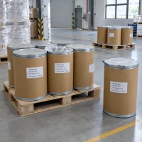 Paracetamol (CAS 103-90-2) packed in 25 kg fiber drums on pallets, one open drum with plastic liner in warehouse