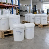 White 25 kg plastic pails of petroleum jelly (CAS 8009-03-8) arranged on wooden pallets in a warehouse