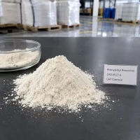 phenylethyl-resorcinol-cas-85-27-8-white-powder-sample A pile of white Phenylethyl Resorcinol powder CAS 85-27-8 on a black table next to a glass dish and a product label.