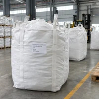 White FIBC ton bags of Sodium Cumene Sulfonate 93% powder CAS 28348-53-0, 500 kg net weight, standing in a warehouse.