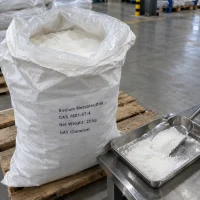 Sodium metabisulfite CAS 7681-57-4 white powder in open 25 kg woven bag with tray and scoop on table