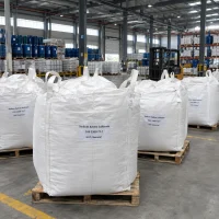 Sodium xylene sulfonate (SXS, CAS 1300-72-7) in white FIBC jumbo bulk bags with lifting loops on pallets in warehouse