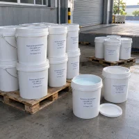 styrene-acrylic-emulsion-cas-25085-34-1-25kg-pails Styrene acrylic emulsion CAS 25085-34-1 in 25 kg white plastic pails on pallets with open pail showing milky liquid