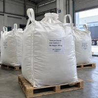titanium-dioxide-tio2-cas-13463-67-7-500kg-fibc-bulk-bags-pallet White FIBC bulk bags labeled Titanium Dioxide TiO2 CAS 13463-67-7 with 500 kg net weight on wooden pallets at a warehouse loading area with a container truck behind.
