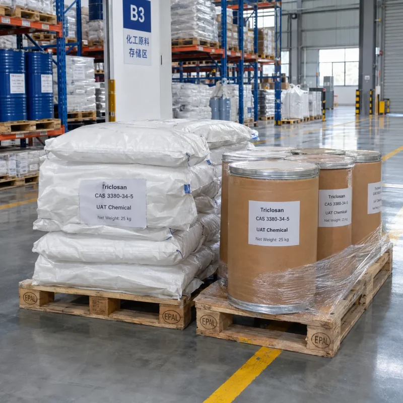Triclosan (CAS 3380-34-5) in 25 kg woven bags and fiber drums on pallets, stretch-wrapped for shipment in warehouse