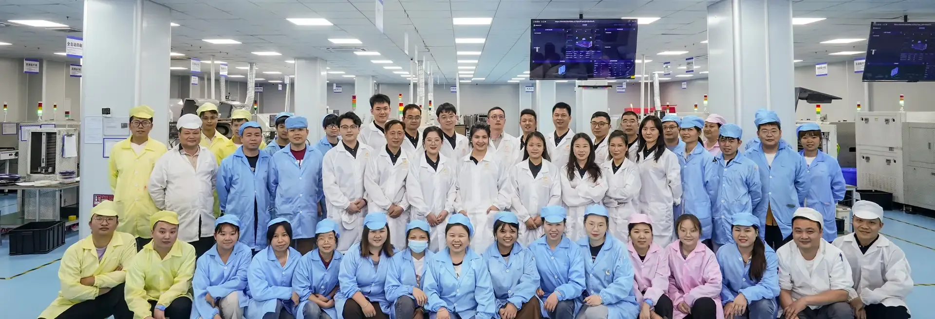 UAT Chemical team and audited factory workers in cleanroom uniforms during a supplier compliance visit