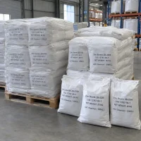 Shrink-wrapped stacks of 25kg white bags of Zinc Borate ZB-2335 CAS 12767-90-7 on wooden pallets in a warehouse.