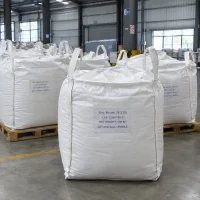 White FIBC bulk bags labeled Zinc Borate ZB-2335 CAS 12767-90-7 with 500 kg net weight on wooden pallets in a warehouse.